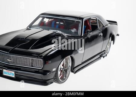 Istanbul, Turkey - July 9, 2014 : A modified Chevrolet Camaro realistic metal model diecast car isolated on white. Stock Photo