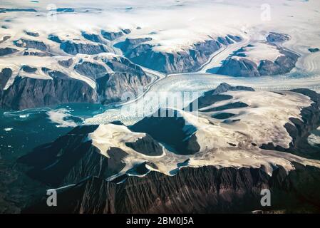 Western coast of Greenland, aerial view of glacier,  mountains and ocean Stock Photo