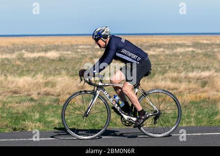 Southport, Merseyside.   UK Weather.  6th May, 2020.  Summer sunshine on a spring day in the resort as local residents take light exercise under coronavirus rules on the Ribble Estuary RSPB reserve coastal path.  Credit: MediaWorldImages/AlamyLive News. Stock Photo