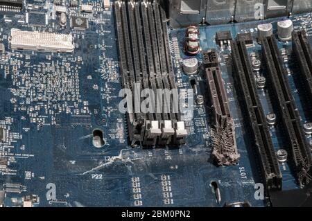 Smashed and broken computer circuit board. Stock Photo