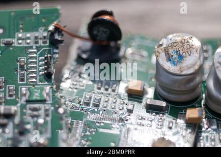 Closeup detail of smashed and broken computer circuit board. Stock Photo