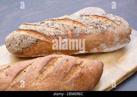 Two pieces of bread on a board Stock Photo