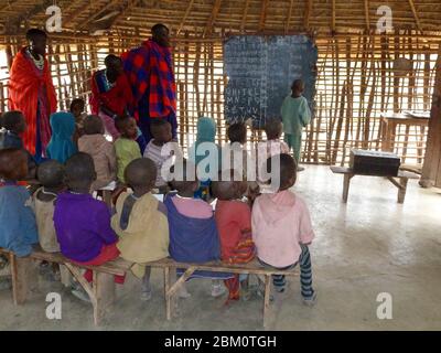 Young Maasai children learning arithmetic and reading in a school room Photographed at Lake Eyasi, Tanzania Stock Photo