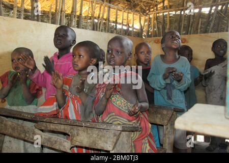 Young Maasai children learning arithmetic and reading in a school room Photographed at Lake Eyasi, Tanzania Stock Photo