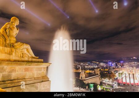 Barcelona skyline in night, scenic view on city from MNAC with Plaça de les Cascades and Magic fountain of Montjuic illuminated during light show Stock Photo
