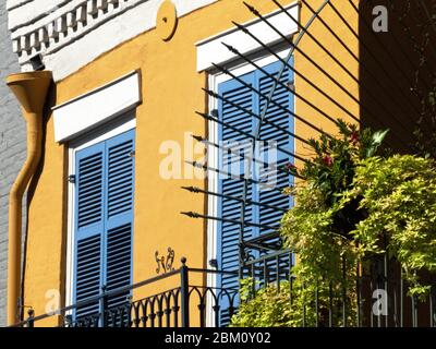 Street in French Quarter in Downtown New Orleans, Louisiana, United States, with its typical balconies and iron railings,