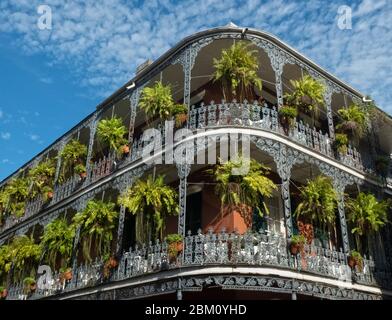 Street in French Quarter in Downtown New Orleans, Louisiana, United States, with its typical balconies and iron railings,