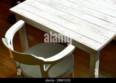 Old chair and empty white painted table. Top view image with copy space. Stock Photo