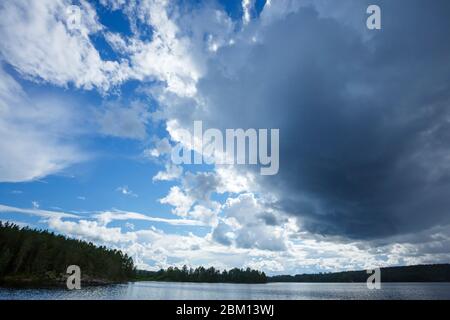 Rainstorm clouds rising over Lake Kallavesi , Finland Stock Photo