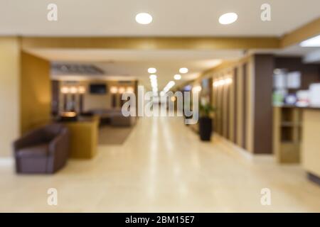 Blurred corridor with light lamps in hotel. Stock Photo