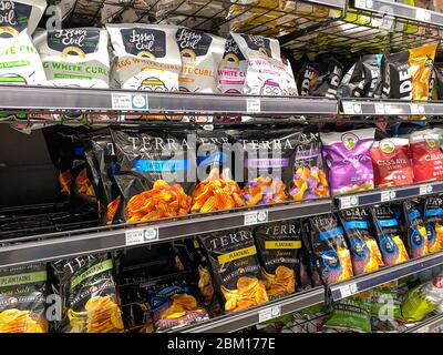 Orlando,FL/USA-5/3/20: A display of Potato, Plantain, and Cassava Chips at a Whole Foods Market Grocery Store. Stock Photo