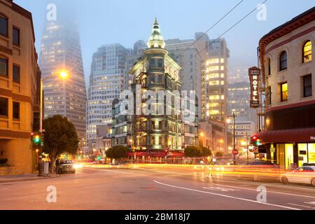 San Francisco, California, United States - Light trails at Columbus Avenue with Sentinel building and Transamerica Pyramid Building. Stock Photo
