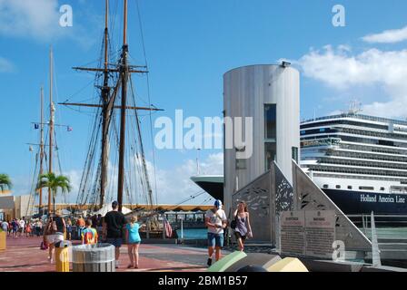 Nieuw Amsterdam cruise ship owned by the Holland America Line and tall ships in the port of San Juan harbour on the Caribbean island of Puerto Rico Stock Photo