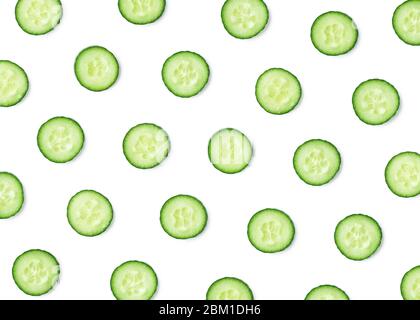 Pattern of fresh cucumber slices isolated on white background. Top view Stock Photo