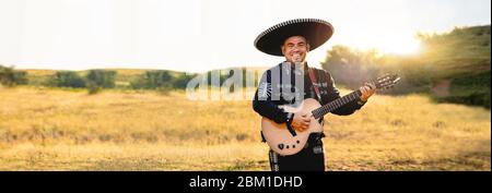 Mexican musician play guitar. Stock Photo