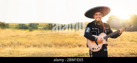 Mexican musician play guitar. Stock Photo