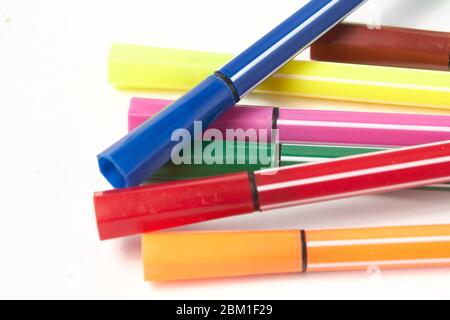 Multi-colored pens, markers on a white background isolate Stock Photo