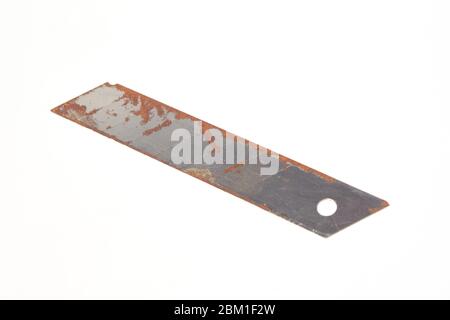 Rusty blade from a clerical knife on a white background isolate Stock Photo