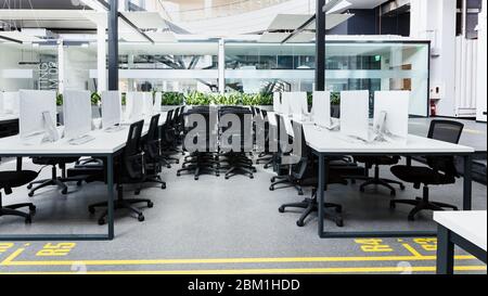 Co-working interior with many computers wrapped in cover Stock Photo