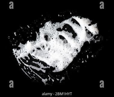 White soap foam on black background, soap bubbles, texture Stock Photo
