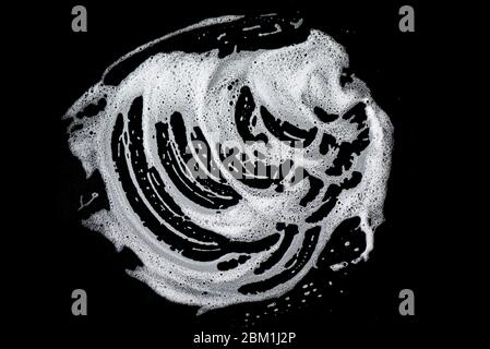 White soap foam on black background, soap bubbles, texture Stock Photo
