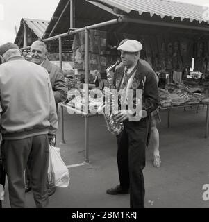 Musicians busking in market, South Elmsall, West Yorshire, Northern England, in 1990 Stock Photo