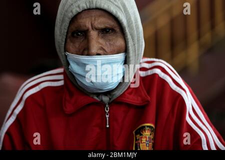 A homeless man wears a face mask as a preventive measure at a temporary shelter amid COVID - 19 Coronavirus.Indonesia Health Ministry recorded a total of 12,438 infections, death 895 and 898 recovered since the beginning of the outbreak. Stock Photo