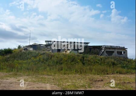 abandoned hangar, old ruined building in the woods Stock Photo