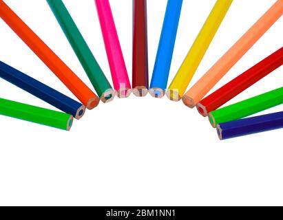 Half round circle made with different colored wood pencil crayons on a white isolated background Stock Photo