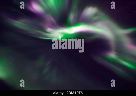 Fanciful patterns of northern lights in endless, deep sky. Stock Photo