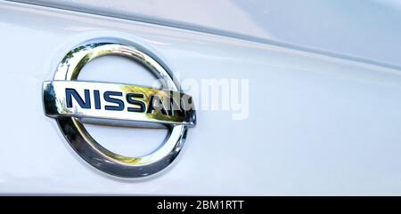 ISTANBUL, TURKEY - AUGUST 22, 2019: Nissan Company Logotype, on white car. Illustrative editorial. Stock Photo