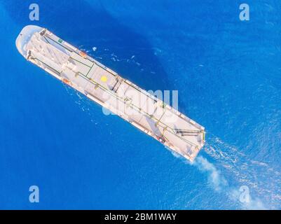 Car carrier shipping out trade port blue sea. Aerial top view Stock Photo
