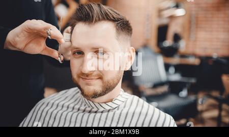 Barbershop concept. Hairdressers barber haircut men in salon Stock Photo