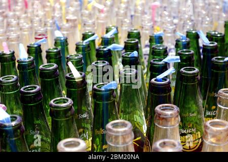 Antipolo City, Philippines - May 5, 2020: Empty bottles of soft drinks and other fruit soda in their case. Stock Photo