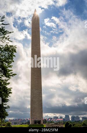 Afternoon sun peaks out from behind the majestic Washington Memorial in Washington, DC, USA. Stock Photo