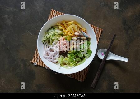 Asam laksa is a sour, fish and tamarind-based soup in Malaysia. Stock Photo