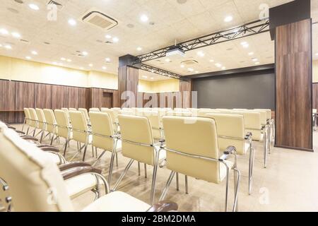 Audience for presentations. Large hall with wooden walls Stock Photo