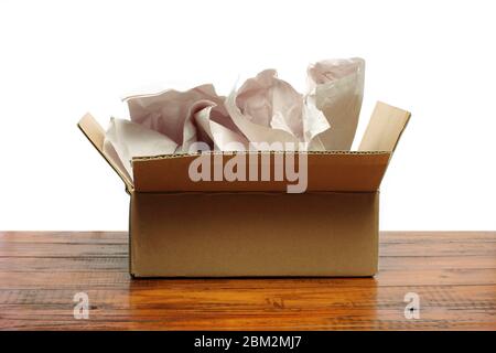 Cardboard Box with Papers on Wooden Background Stock Photo