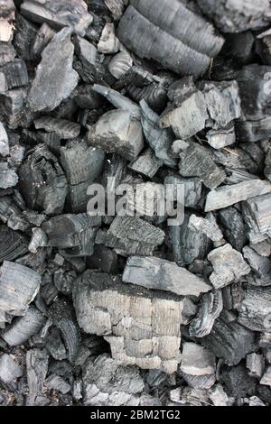 Burnt firewood texture. Cold coals of burnt wood background. Top view Stock Photo