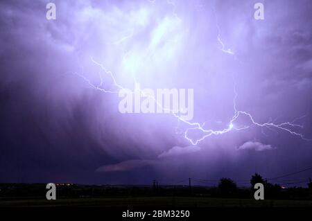Lightning bolts  illuminate the stormy sky over Monteton, Lot-et-Garonne, France Stock Photo