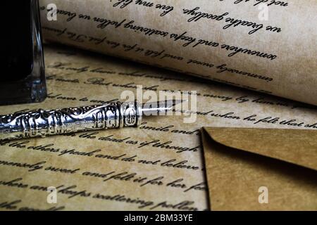 Viersen, Germany - May .6. 2020: Macro closeup of retro ink pen, old vintage paper with handwritten text Stock Photo