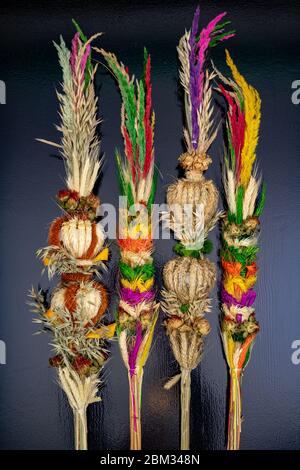 Easter palms on the table. Dry flowers and cereals entwined in a wreath. Dark background. Stock Photo