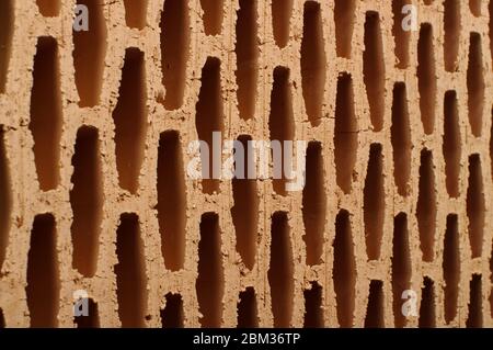 Abstract close up of ceramic building block for house construction made from natural clay Stock Photo