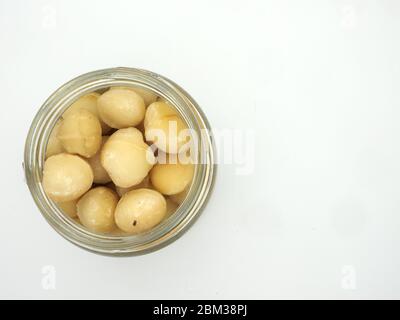 Top View Of A Jar Of Macadamia Nuts On A White Background, London, UK Stock Photo