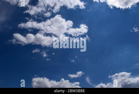 Beautiful blue sky with clouds background. Sky with clouds weather nature clouds and blue sky with sun. Aerial sky and clouds background. Stock Photo