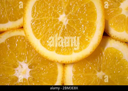 Fresh juicy orange. Abstract background with citrus-fruit of orange slices. Close-up. Studio photography. Stock Photo