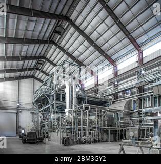 Natural gas plant structures inside compression housing Stock Photo