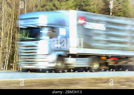 Delivery track speeding on a highway colorful painting looks like picture Stock Photo