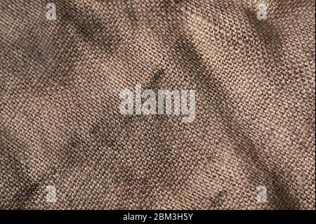 twine and burlap on a black wooden background, still life, texture Stock Photo