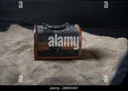 old wooden decorative chest on a black background still life Stock Photo